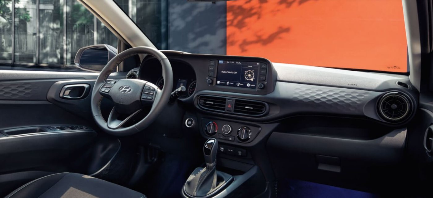 Closer view at the front part of Hyundai car with its logo and grille
